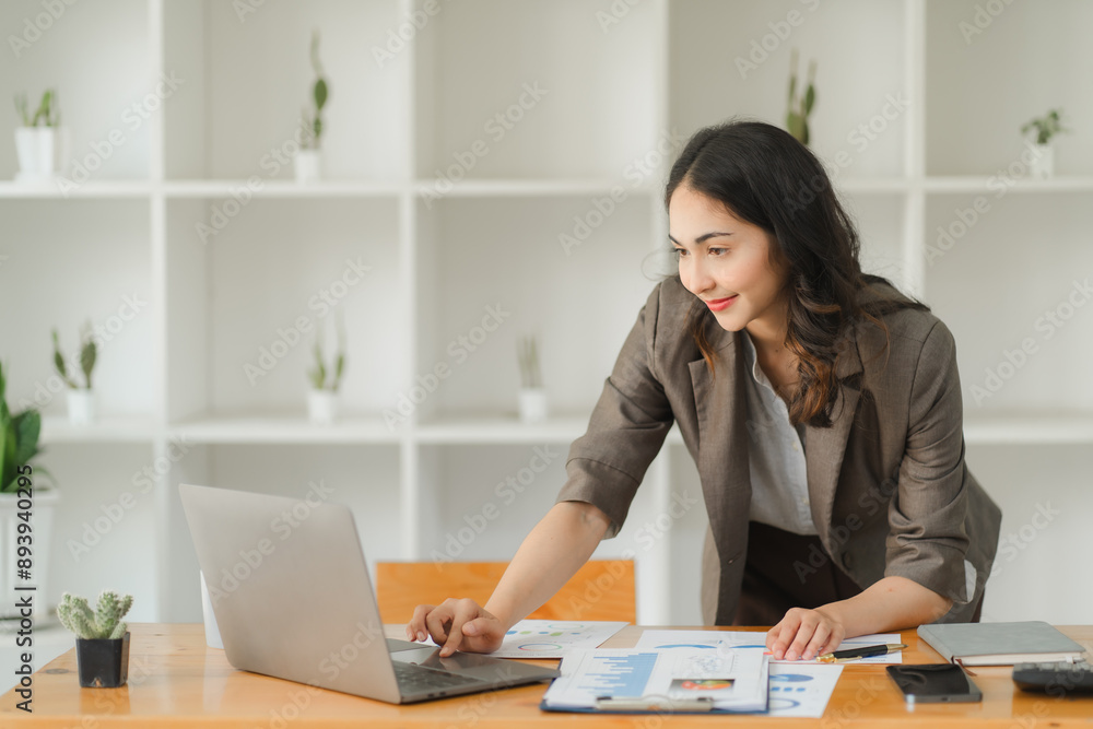Young smart Asian businesswoman working with laptop computer, preparing for the next meeting. Young smart Asian businesswoman working with laptop computer, preparing for the next meeting.