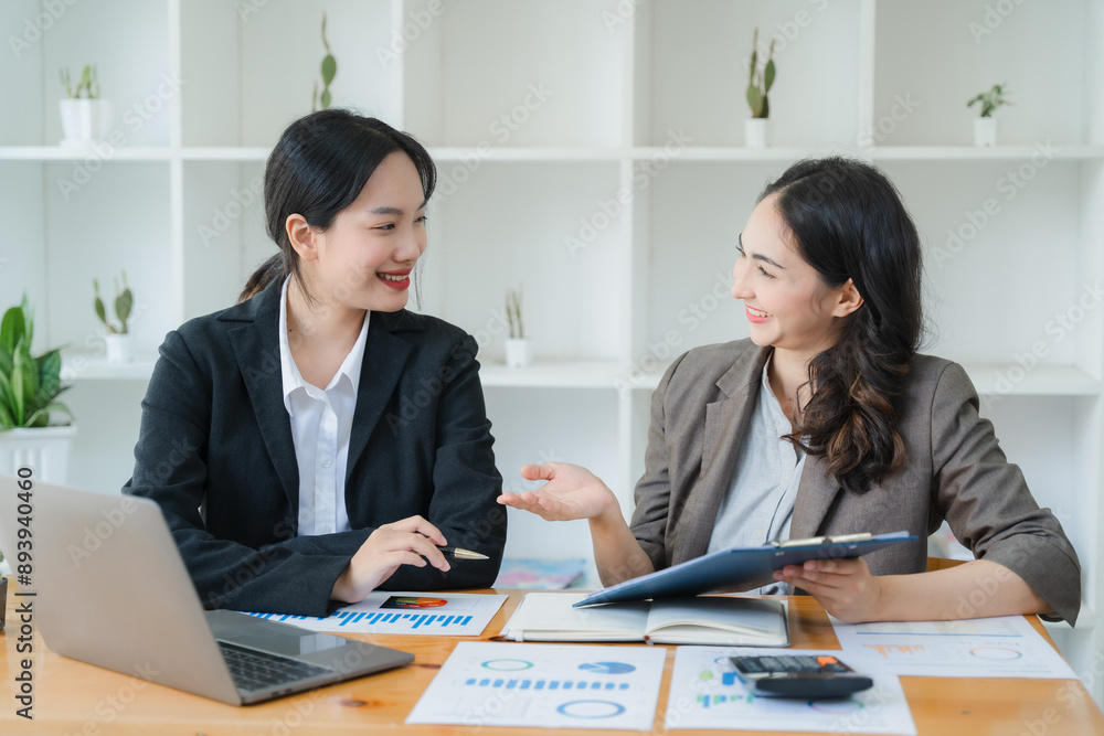 Diverse beautiful Asian girls working together in modern office Collaborate at a table with a laptop and participate in discussions Diverse beautiful Asian girls working together in modern office Collaborate at a table with a laptop and participate in discussions