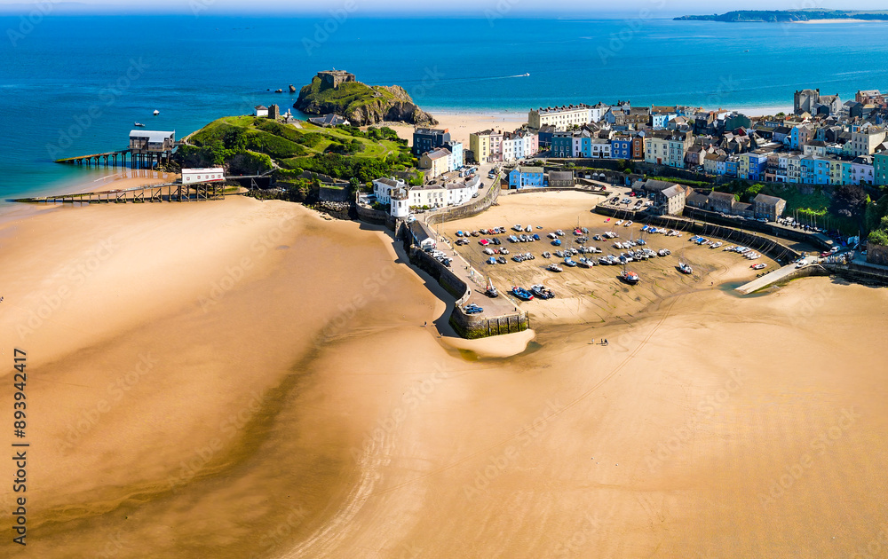 Fototapeta premium Aerial view of Tenby harbour at low tide during summer