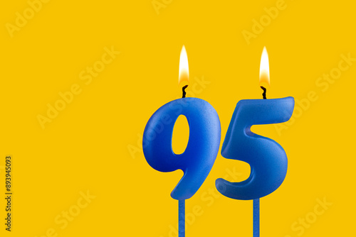 Blue candle number 95 - Birthday on yellow background