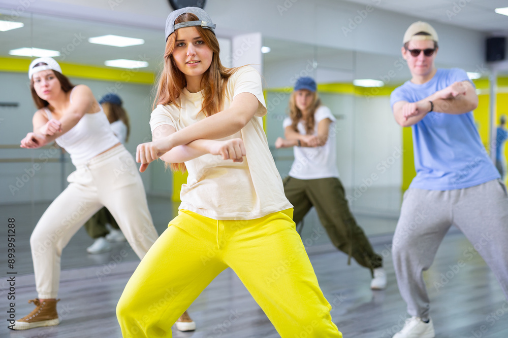 Fototapeta premium Focused teenages hip hop dancers doing dance workout during group class