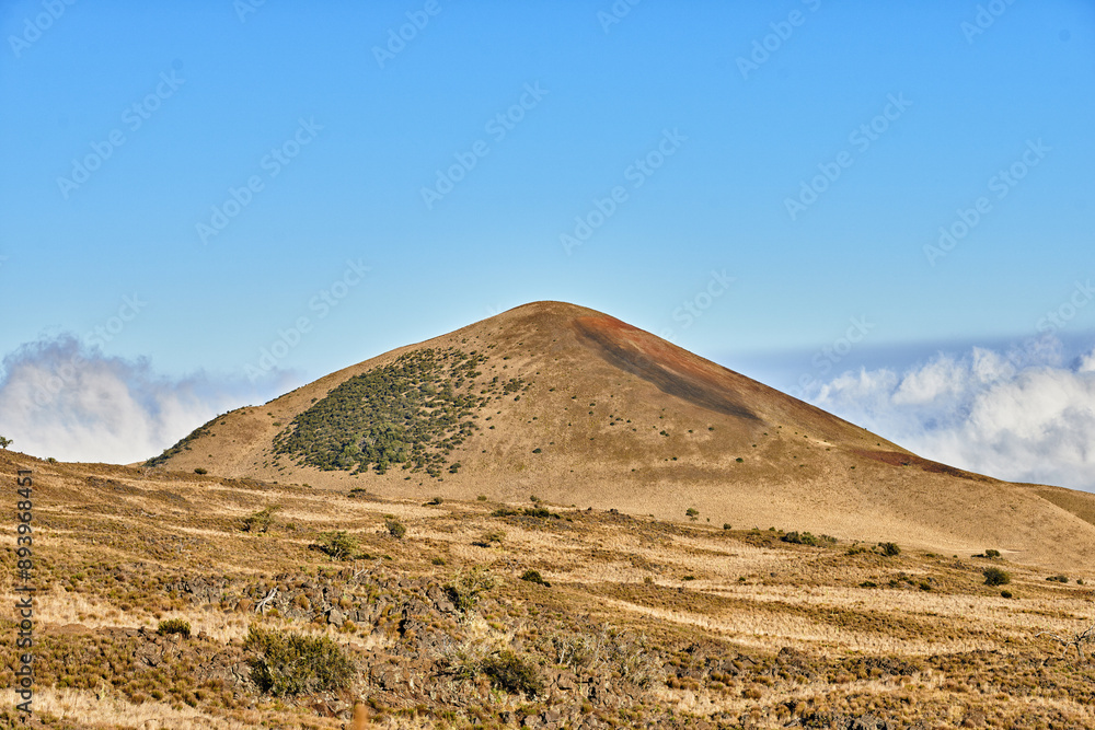 Landscape, volcano and clouds in blue sky in nature with eco friendly, travel and tourism location. Desert, Mauna Loa and wilderness for sightseeing destination on vacation or holiday in Hawaii. Landscape, volcano and clouds in blue sky in nature with eco friendly, travel and tourism location. Desert, Mauna Loa and wilderness for sightseeing destination on vacation or holiday in Hawaii.