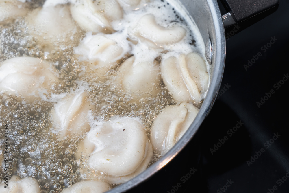 Close-Up Of Boiling Pelmeni Dumplings Close-Up Of Boiling Pelmeni Dumplings