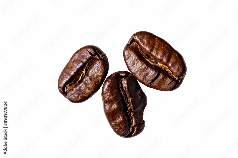 Obraz premium Three brown coffee beans in a white background.