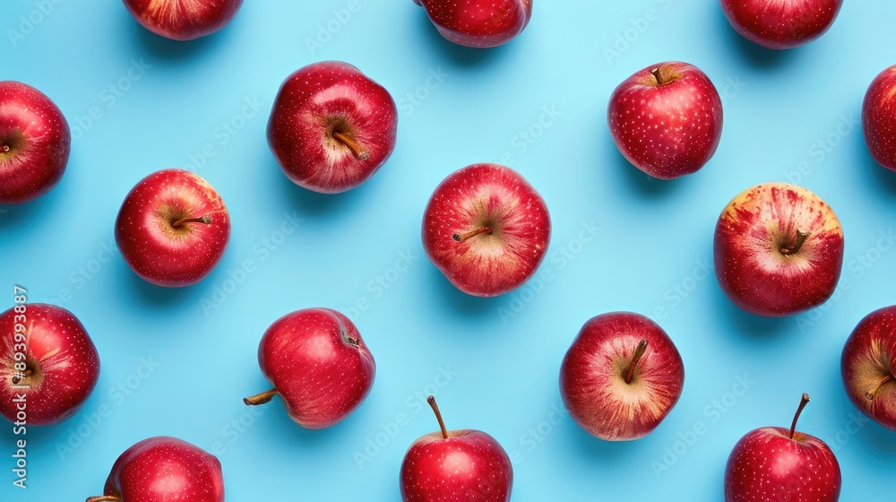 Red apples on light blue background. Minimal flat lay food texture. Trendy fresh summer concept. Red apples on light blue background. Minimal flat lay food texture. Trendy fresh summer concept.