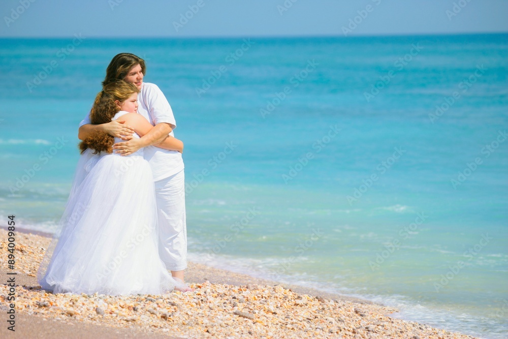Parent Embracing Child On The Beach Parent Embracing Child On The Beach