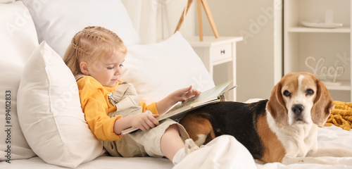 Cute little girl with book ...
