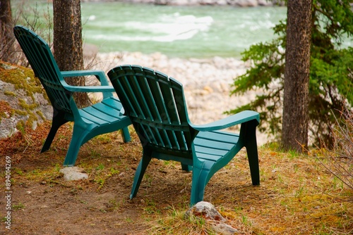 Lawn Chairs Situated By The Water