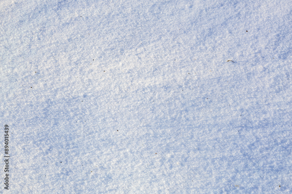 A blue sky with snow on the ground, winter background or backdrop A blue sky with snow on the ground, winter background or backdrop