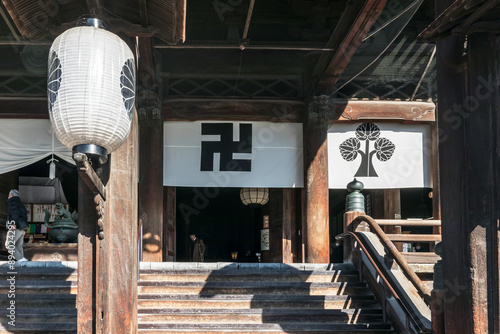 Nagano, Japan - December 24, 2023: Hondo Main Hall of the  Zenkoji Buddhist temple. Swastika sign called manji used as a positive symbol of Buddhism.