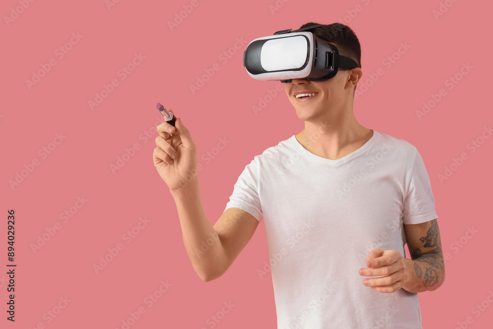 Male makeup artist in VR glasses with lipstick on pink background Male makeup artist in VR glasses with lipstick on pink background