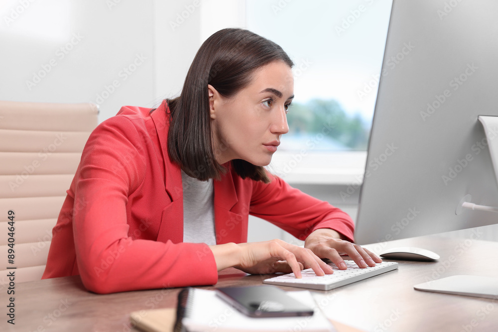 Woman with poor posture working in office Woman with poor posture working in office