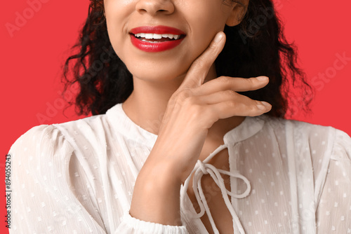 Smiling woman with red lips...