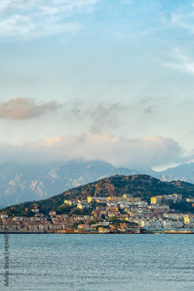 Scenic Coastal View of a Mountainous Landscape with Urban Development Scenic Coastal View of a Mountainous Landscape with Urban Development