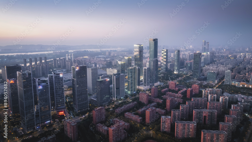 Obraz premium Vibrant Night Cityscape with Skyscrapers and Urban Lights