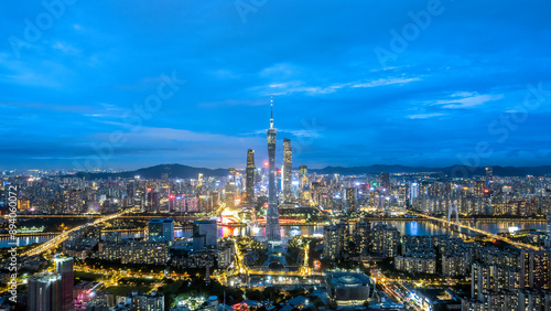 Stunning Cityscape at Night with Illuminated Skyline and Beautiful Clouds