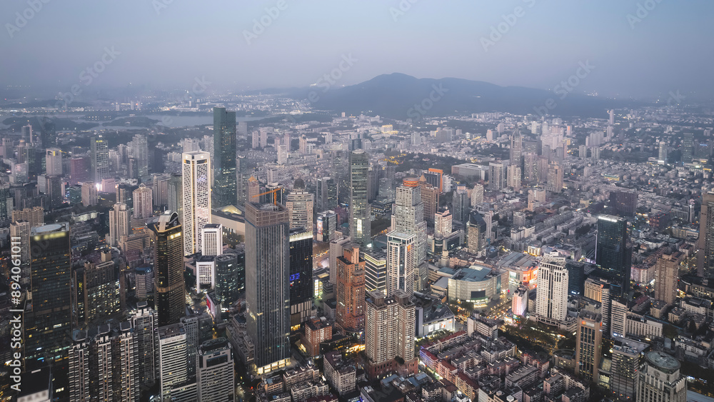 Fototapeta premium Stunning Aerial View of a Bustling Urban Cityscape at Dusk