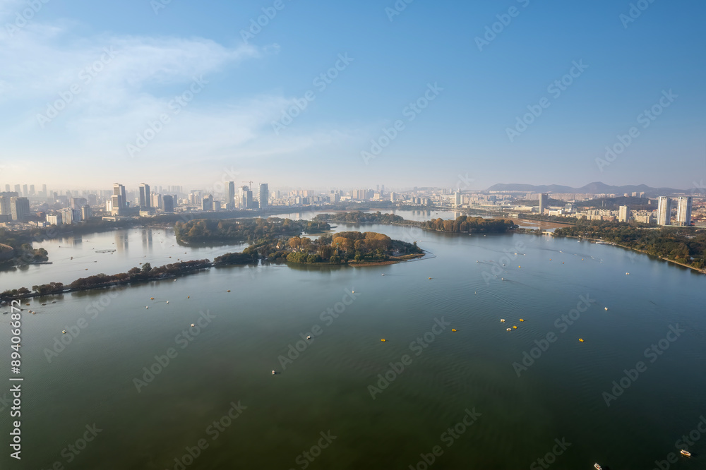 Serene Urban Lakeview with City Skyline and Lush Islands Serene Urban Lakeview with City Skyline and Lush Islands