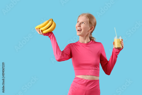 Happy sporty young woman wi...