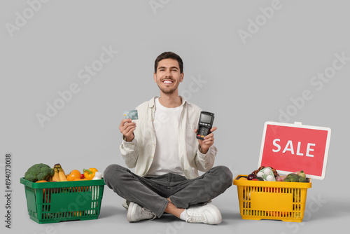 Young man with credit card,...