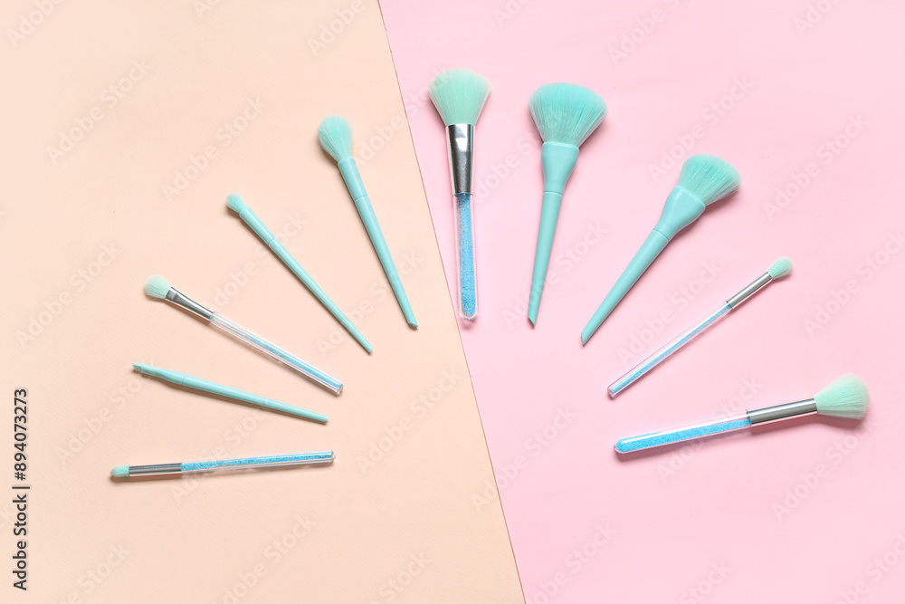 Different stylish makeup brushes on color background Different stylish makeup brushes on color background