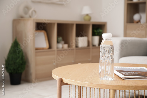 Bottle of water with magazi...