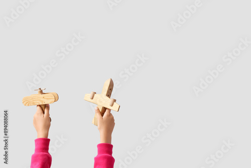 Child with wooden planes on...