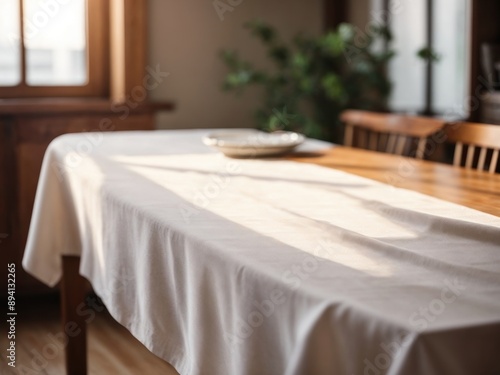 Empty white table cloth on wooden desk