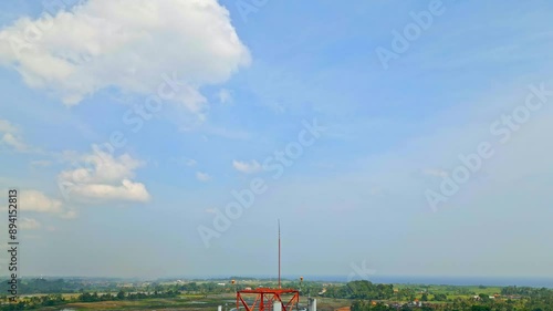 Aerial View 5g Telecommunication Cellular Tower Standing Against Sky with Green Landscape in Background. Concept Communication Infrastructure. Telecom Antenna and Satellite Transmit Signal 4k
