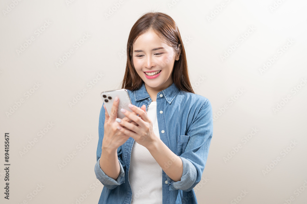 Happy asian young woman using mobile smart phone, read good news online, laugh excited getting offer, great positive surprise, celebrate success on smartphone. Smile girl isolated on white background. Happy asian young woman using mobile smart phone, read good news online, laugh excited getting offer, great positive surprise, celebrate success on smartphone. Smile girl isolated on white background.