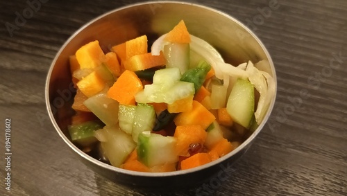 Acar timun, traditional Indonesian cucumber pickle. A complementary food containing fermented diced carrots and cucumbers. photo