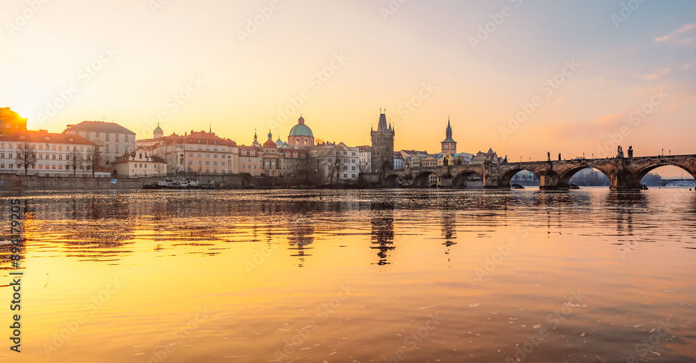 View of the city of Prague. Vltava river with Old Town Bridge Tower on  Charles bridge  in Prague, Czech Republic.