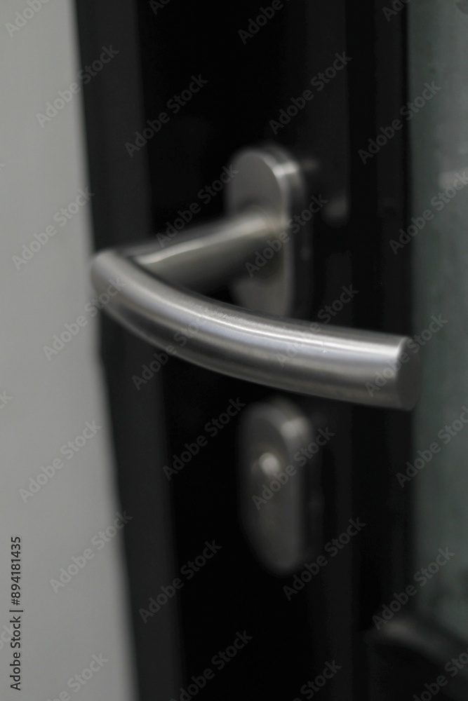 close up of modern door handle with lock. close up of modern door handle with lock.