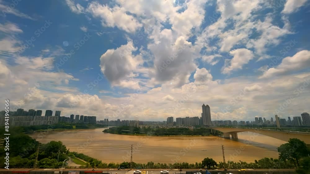 Time-lapse photography of buildings and sky along the Yong River in Nanning, Guangxi, China Time-lapse photography of buildings and sky along the Yong River in Nanning, Guangxi, China