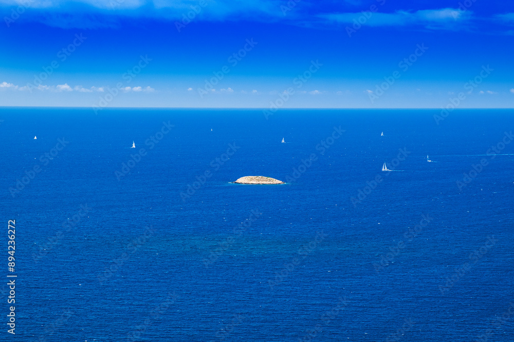 Small island in blue sea, aerial view near Primosten, Dalmatia, Croatia