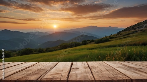 Sunset view of mountain landscape with wooden table in foreground. Perfect for showcasing products with serene natural backgrounds