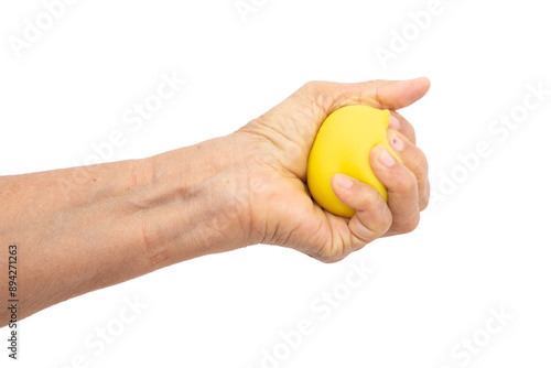 Female hand squeezing stress ball on white background