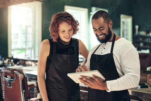 Barber shop, teamwork and people on tablet in salon for calendar, online appointment and website. Collaboration, small business and hairdressers on digital tech for haircare, grooming and hairstyle