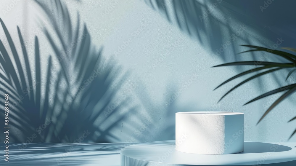 Eco-friendly cosmetic display: minimal blue and white backdrop with cylindrical podium and palm leaf shadows. Eco-friendly cosmetic display: minimal blue and white backdrop with cylindrical podium and palm leaf shadows.