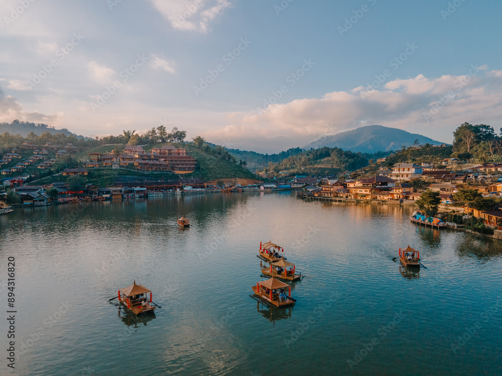 Fototapeta premium Chinese boats and a cloudy sunset at Ban Rak Thai village Thailand