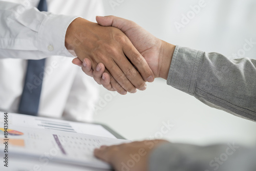 Businessman shaking hands successful making a deal. mans handshake. Business partnership meeting concept