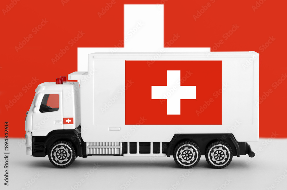 Switzerland flag depicted on side wall of white delivery van close up. Shipping and local delivery concept Switzerland flag depicted on side wall of white delivery van close up. Shipping and local delivery concept