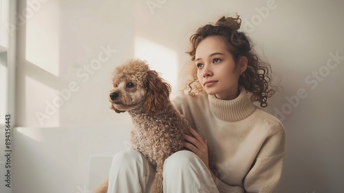 Portrait of young lady sitting on white cube stage with her lovely cute groomed Poodle against beige background Concept of animal pet lover friendship domestic life veterinary : Generative AI photo