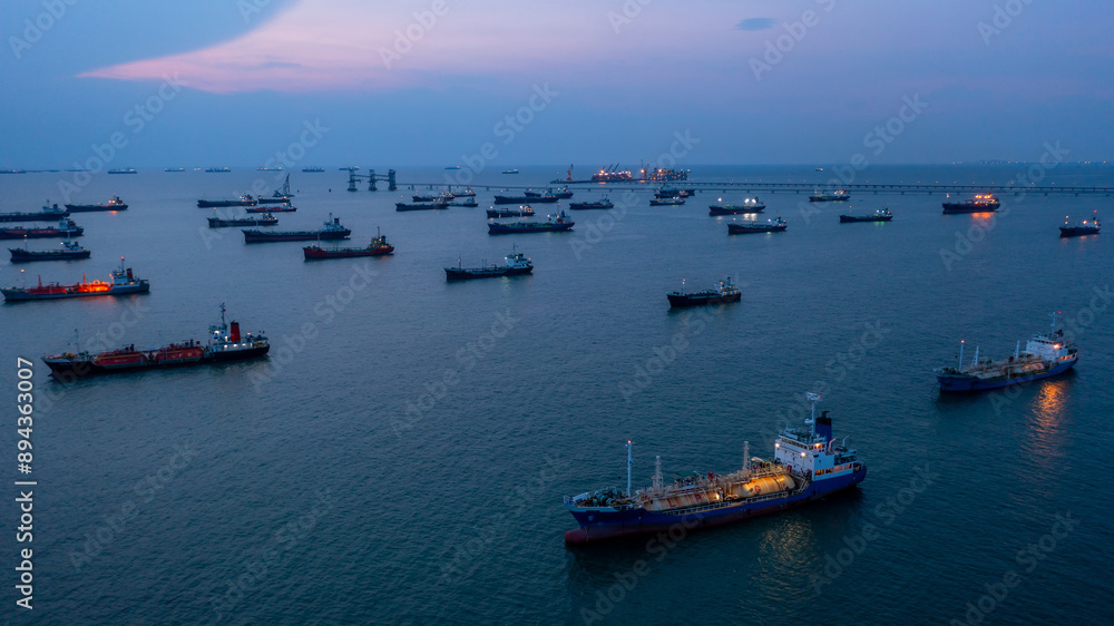 Aerial view Oil and Gas tanker ship LPG tanker ship transportation oil and gas from refinery on the sea at night, Oil and Gas tanker ship global business logistic refinery transportation. Aerial view Oil and Gas tanker ship LPG tanker ship transportation oil and gas from refinery on the sea at night, Oil and Gas tanker ship global business logistic refinery transportation.