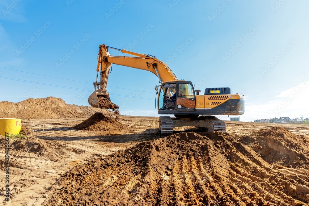 Yellow Excavator at Construction Site. Yellow Excavator at Construction Site.