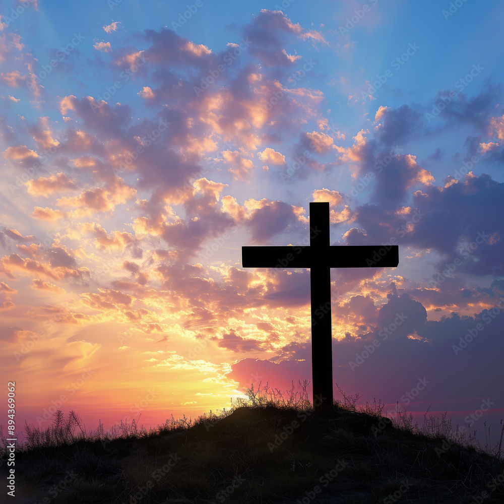 The cross stands tall on Calvary hill, its silhouette against the vibrant hues of sunrise and sunset. The empty space invites reflection on the Christian concept of Ascension Day. The cross stands tall on Calvary hill, its silhouette against the vibrant hues of sunrise and sunset. The empty space invites reflection on the Christian concept of Ascension Day.