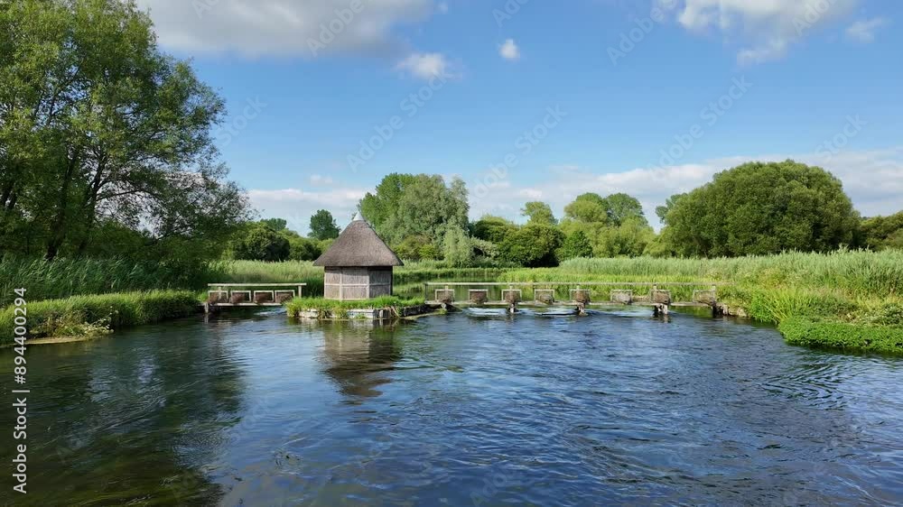 Longstock Stockbridge England. 17.07.2024. River Test flowing through the Hampshire countryside UK