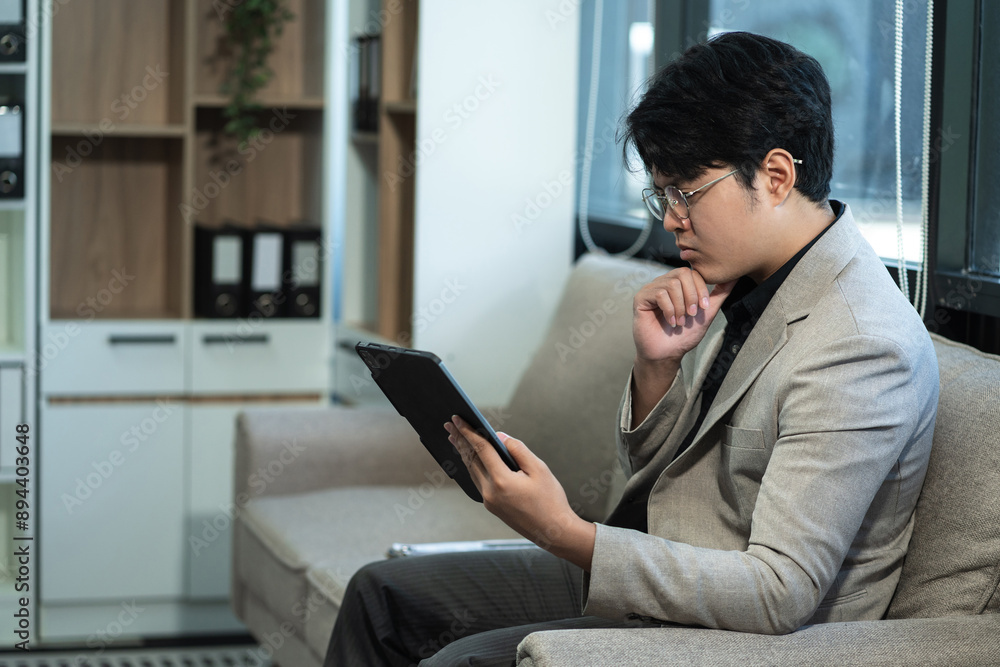 Business man working at office with smartphone and documents on desk, financial adviser analyzing data. Business man working at office with smartphone and documents on desk, financial adviser analyzing data.