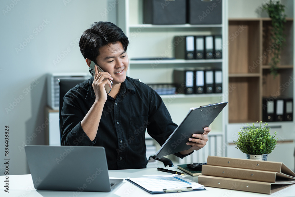 Businessman using laptop computer in office. Happy man, entrepreneur, small business owner working online. Businessman using laptop computer in office. Happy man, entrepreneur, small business owner working online.