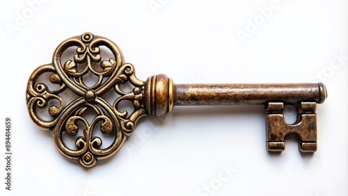 Old ornate key with delicate engravings and rusty patina lies isolated on a worn, creamy white backdrop, evoking nostalgia and forgotten secrets.